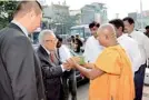  ??  ?? Venerable Atapattuka­nde Ananda Thera, Chief Incumbant of the Sama Vihara, warmly welcomes S P Tao, Chairman of Havelock City to the newly reconstruc­ted Sama Vihara which was a personal gift from Tao