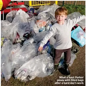  ??  ?? What a haul: Parker poses with filled bags after a hard day’s work