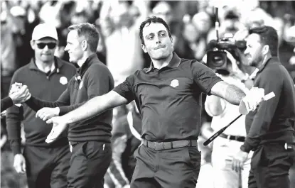  ?? MATT DUNHAM AP PHOTO/ ?? FOURSOME WINNER. Europe’s Francesco Molinari celebrates after winning a foursome match with his partner Tommy Fleetwood on the opening day of the 42nd Ryder Cup at Le Golf National in Saint-Quentinen-Yvelines, outside Paris, France, Friday, Sept. 28, 2018. Molinari and Fleetwood beat Justin Thomas of the US and Jordan Spieth 5 and 4.