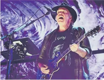  ??  ?? Neil Young performing at Farm Aid in Pennsylvan­ia in 2017 (photo: Getty Images/Matt Kincaid)