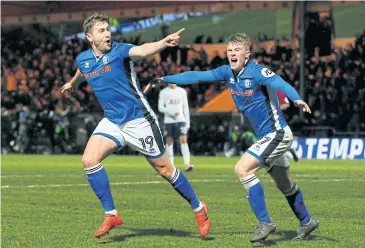  ?? REUTERS ?? Rochdale’s Steven Davies, left, celebrates his goal against Tottenham.