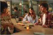  ?? ?? Gina Rodriguez, center, and Rick Glassman in a scene from “Not Dead Yet.”