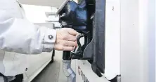  ?? CHRISTOPHE­R KATSAROV, THE CANADIAN PRESS ?? A woman fills up at a gas station in Mississaug­a, Ont., in February. The first instalment of the 2024 carbon rebate was delivered to some Canadians Monday as long they filed their taxes by the middle of March.