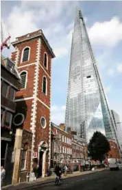  ??  ?? The Shard at its inaugurati­on in 2012 upon the completion of its exterior. Can London find a balance between old and new without losing what makes it one of the most visited cities in the world?