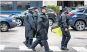  ?? TERRENCE ANTONIO JAMES/CHICAGO TRIBUNE ?? Chicago police patrol on Chicago Avenue at Michigan Avenue on Friday.