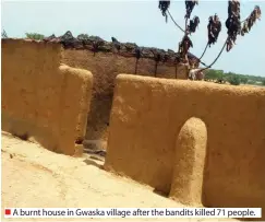  ??  ?? A burnt house in Gwaska village after the bandits killed 71 people.