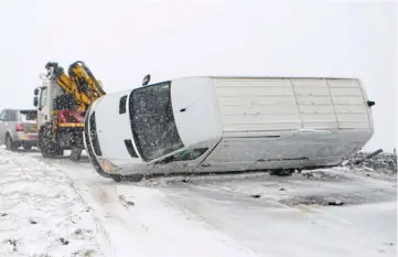  ?? ?? Whiteout van man: Vehicle is righted after tipping over in the Peak District town