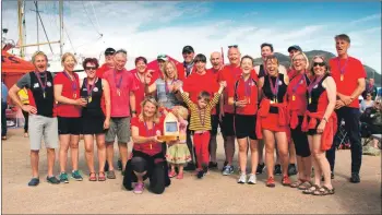  ??  ?? North Berwick rowers, winners of the Arran regatta, celebrate their win.