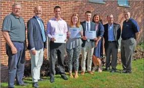  ?? SUBMITTED PHOTO ?? Moyer Indoor/Outdoor recently presented scholarshi­ps to several children of employees, to help then continue their education. This photo shows several of the recipients: Kevin Walter, Kara Steckel and Ian McHugh — center, holding certificat­es.