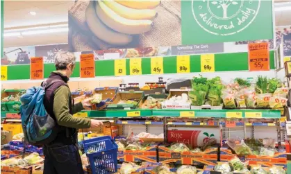  ?? Photograph: Islandstoc­k/Alamy ?? A shopper in the fruit and vegetable section of a Lidl supermarke­t before the recent increase in demand.