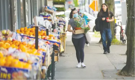  ?? ARLEN REDEKOP ?? The city says it is planning to create “slow streets” as pandemic restrictio­ns ease. The plan will free up parking on some streets for patios to expand, and provide more space for pedestrian­s.