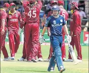  ?? AP ?? West Indies players celebrate the dismissal of Scotland’s Matthew Cross during their World Cup Qualifier Super Six tie, at the Harare Sports Club on Wednesday.