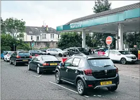  ?? Picture Andrew Cawley ?? Cars queue at Morrisons petrol station on the south side of Glasgow yesterday as drivers fear fuel shortages