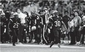  ?? Tim Warner / Contributo­r ?? Hightower’s Isaiah Essissima (30) celebrates after a second-half intercepti­on against Texas City during Friday night’s game at Hall Stadium in Missouri City.