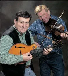  ?? COURTESY PHOTO ?? BROTHERS EVAN MARSHALL (LEFT) AND JOHN MARSHALL combined their early training as classical violinists with influences from various country and comedy performers to develop Billy and the Hillbillie­s.