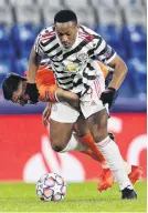  ?? PHOTO: REUTERS ?? Istanbul Basaksehir’s Irfan Kahveci (front) and Manchester United’s Anthony Martial get in a tangle during a Champions League Group H match at Basaksehir Fatih Terim Stadium in Istanbul yesterday.