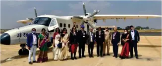  ?? ?? Alliance Air and HAL personalit­ies pose with HAL-Dornier 228 light transport aircraft