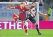  ?? REUTERS ?? AS Roma's Edin Dzeko (left) fights for the ball with Juventus' Emre Can during their match on Sunday.