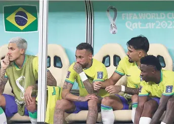  ?? ?? Neymar (centre) sits on the bench after being substitute­d during the the match between Brazil and Serbia at the Lusail Stadium in Lusail. — AFP file photo