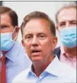  ?? John Minchillo / Associated Press ?? The state saw more than 400 new COVID-19 infections, pushing the infection rate to 3 percent, Gov. Ned Lamont announced Tuesday.