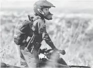  ?? U.S. BORDER PATROL/The Associated Press ?? A U.S. Border Patrol agent with the Tucson Sector in Arizona rides her ATV while on patrol. Only five per cent of the U.S.’s 21,000 border patrol agents are women.