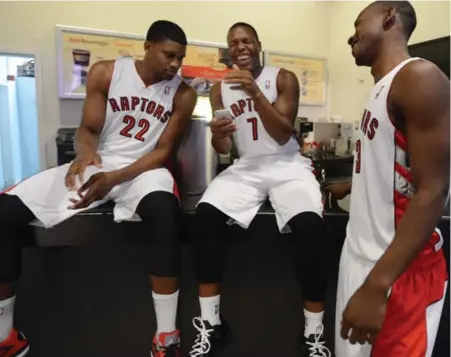  ?? VINCE TALOTTA/TORONTO STAR ?? Raptors, from left, Rudy Gay, Kyle Lowry and Terrence Ross have a little fun during the team’s media day at the Air Canada Centre on Monday.