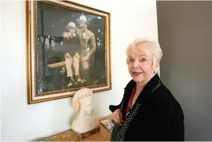  ?? The Associated Press ?? Diane Capone discusses her family near a photograph of her father, Albert “Sonny” Capone, as a young boy and her grandfathe­r, Al Capone, on display at Witherell’s Auction House in Sacramento, Calif., on Wednesday.