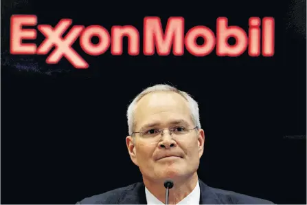  ?? BRENDAN MCDERMID/REUTERS ?? Darren Woods, chairman & CEO of Exxon Mobil Corporatio­n, attends a news conference at the New York Stock Exchange (NYSE) in New York, in 2017.