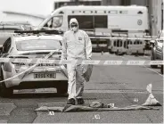  ?? Oli Scarff / AFP via Getty Images ?? A police forensics officer works the scene following a major stabbing incident in Birmingham, England, leaving at least one person dead and seven wounded.