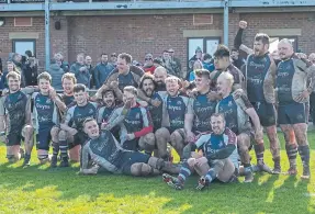  ?? ?? Scarboroug­h RUFC players celebrate winning on the final day of the season to stay up.