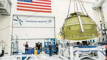  ?? FILE ?? The Orion crew module pressure vessel for the Artemis III mission — the first vehicle under the Lockheed Martin OPOC contract undergoes assembly at NASA’s Kennedy Space Center.