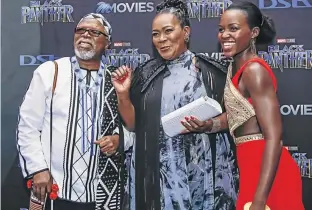  ??  ?? John Kani, Connie Chiume and Lupita Nyong’o at the South African premiere of Marvel Studio’s Black Panther at Montecasin­o in Johannesbu­rg at the weekend. The film, starring a predominan­tly black cast, has won plaudits the world over.