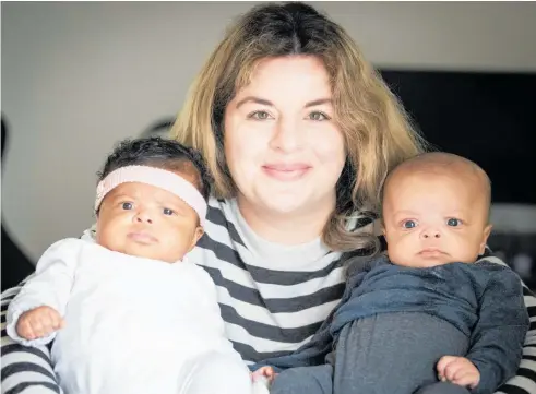  ?? Photo / Jason Oxenham ?? Sarah Le Guennec at home with her 11-week-old twins Victoria (left) and Benjamin Olatunbosi­n. A night nurse relieves Sarah of the overnight duties of feeding and monitoring them.