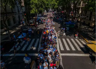  ??  ?? Above The queue to see Maradona’s coffin stretched for over two miles – even without social distancing