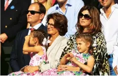  ??  ?? Federer’s agent, Tony Godsick, his mother, Lynette, and his wife, Mirka, with twin daughters Myla Rose and Charlene Riva, in 2014