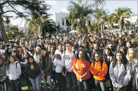  ?? Genaro Molina Los Angeles Times ?? VENICE HIGH SCHOOL students listen as the 17 victims of the Parkland, Fla., shooting are honored during Wednesday’s walkout.