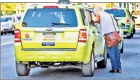  ??  ?? GOING GREEN? Searching in Coney Island, a Post reporter finally finds a green-cab driver willing to go into Manhattan. Many commuters aren’t so lucky.