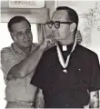  ?? PACIFIC DAILY NEWS ?? In an undated file photo, Father Louis Brouillard receives a Boy Scouts of America award that recognizes exceptiona­l character and service. Brouillard, a priest in Guam from 1948 to 1981 who has been identified as an abuser in 55 lawsuits, also was a...