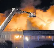  ?? MATTHEW HORWOOD ?? The fire at Glyn Derw High School, Ely