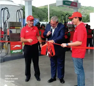  ??  ?? Cutting the ribbon on a new fuel station