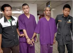  ??  ?? Canthi Cantupa (second right) and his son were sentenced to two years’ jail by the Sessions Court. — Bernama photo Jamal smiles outside the court after he was sentenced. — Bernama photo