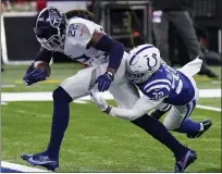  ?? AJ MAST — THE ASSOCIATED PRESS ?? Titans running back Derrick Henry (22) scores a touchdown past Colts free safety Julian Blackmon on Nov. 29 in Indianapol­is.