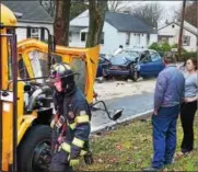  ??  ?? A section of Farmington Avenue in Upper Pottsgrove Township was closed Wednesday afternoon after a blue Ford Focus slammed head-on into a school bus. Several people were injured.