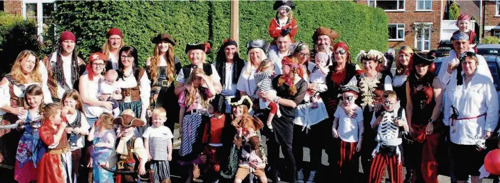  ?? Gary Louth ?? The Burgess brood pictured at a recent family fancy dress party with Joyce, center to the left of the lamp-post