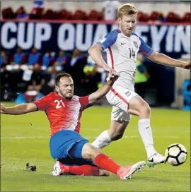  ?? Julio Cortez Associated Press ?? COSTA RICA’S Marcos Urena, left, scores as Tim Ream of the U.S. defends in a World Cup match in September. Urena has three preseason goals with LAFC.