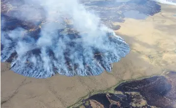  ?? MATT SNYER / ALASKA DIVISION OF FORESTRY VIA AP FILES ?? A study of 2015 wildfires in Alaska found about 5.1 million acres were burned, the second-worst fire season on record for the state, with an unseasonab­ly warm spring, early snow melt and a June heat wave partly to blame for carnage.