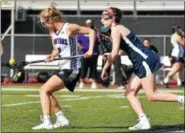  ?? BARRY TAGLIEBER - FOR DIGITAL FIRST MEDIA ?? Phoenixvil­le’s Emma Visnov, left, collects a groundball as Spring-Ford’s Mac Maloney chases during Monday’s game.