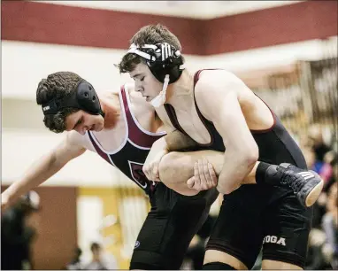  ?? NATE HECKENBERG­ER - FOR MEDIANEWS GROUP ?? Conestoga’s Ezra Toll gets a leg against Lower Merion’s Hutton Smith before winning by fall.