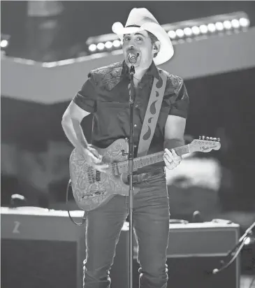  ?? ANDREW NELLES / THE TENNESSEAN ?? Brad Paisley performs Sept. 12 during the taping of the “CMT Giants: Vince Gill” special at The Fisher Center for the Performing Arts in Nashville.