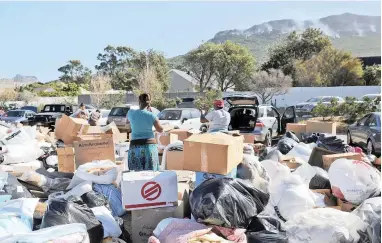  ?? PICTURE: DAVID RITCHIE ?? RELIEF: Thousands of people have donated food, clothes and other items to the victims of the Imizamo Yethu fire. The city’s disaster management reported that about 3 500 structures were ravaged by the fire.